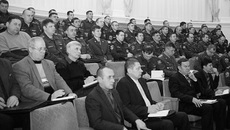 Во время совещания.